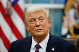A photo of President Donald Trump with the American flag in the background